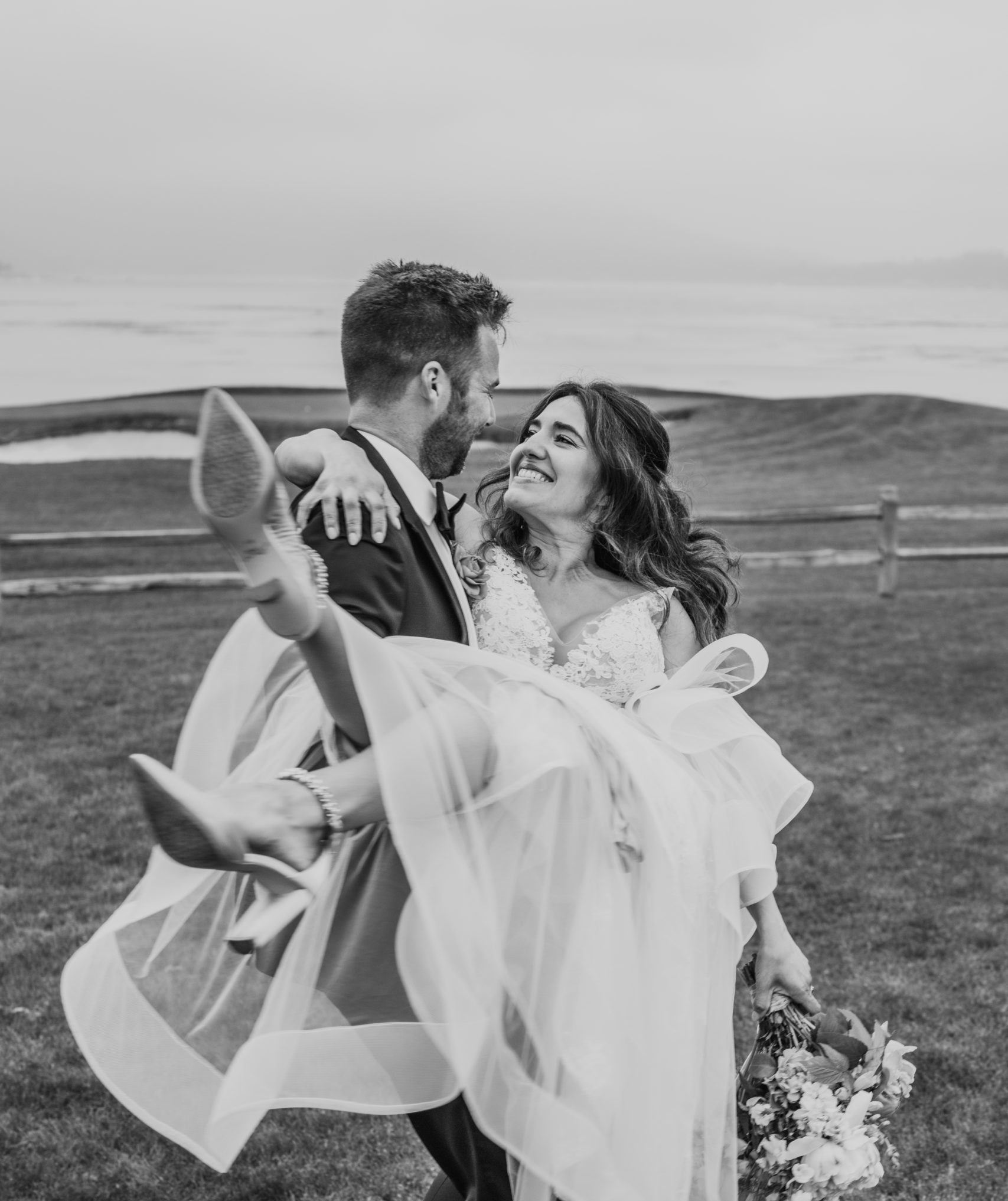 Romantic-Groom-Carrying-Bride-Pebble-Beach