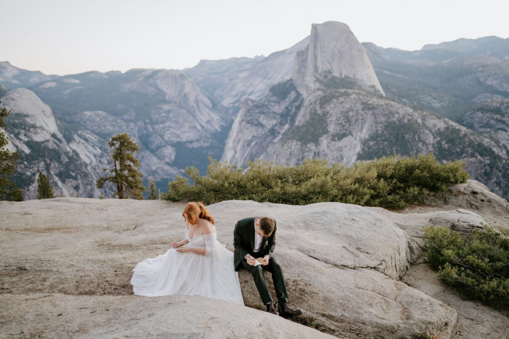 couple writing wedding vows at Glacier Point in Yosemite