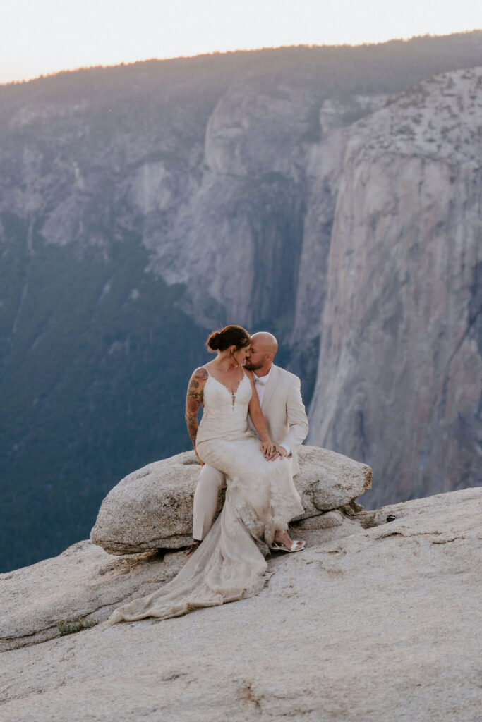 groom kissing the bride on the forehead