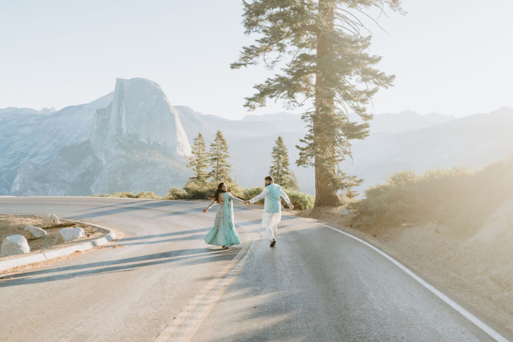 Glacier point road in yosemite eloping couple running at sunrise