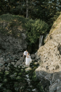 couple climbing rocks