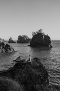 adventure elopement in black and white at oregon beach