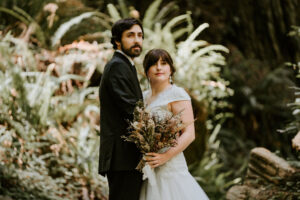 couple poses during redwood elopement