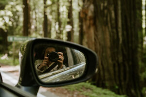 detail image of photographer in mirror in the redwoods