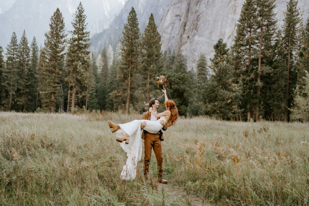 couple cheering after El Capitan Meadow wedding ceremony in Yosemite