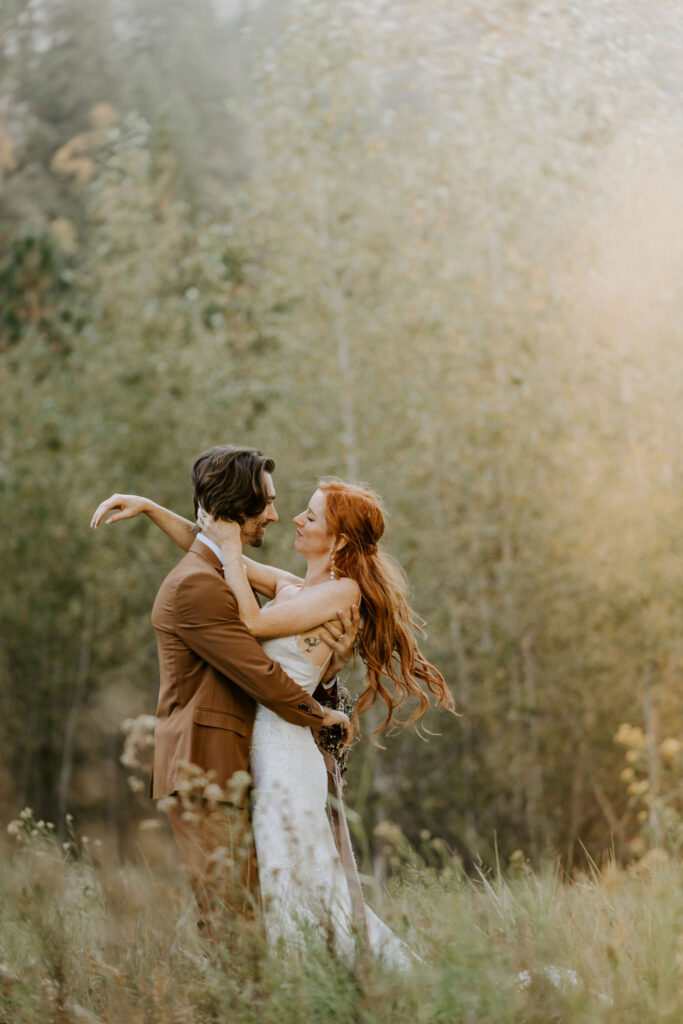 couple hugging at El Capitan meadow wedding