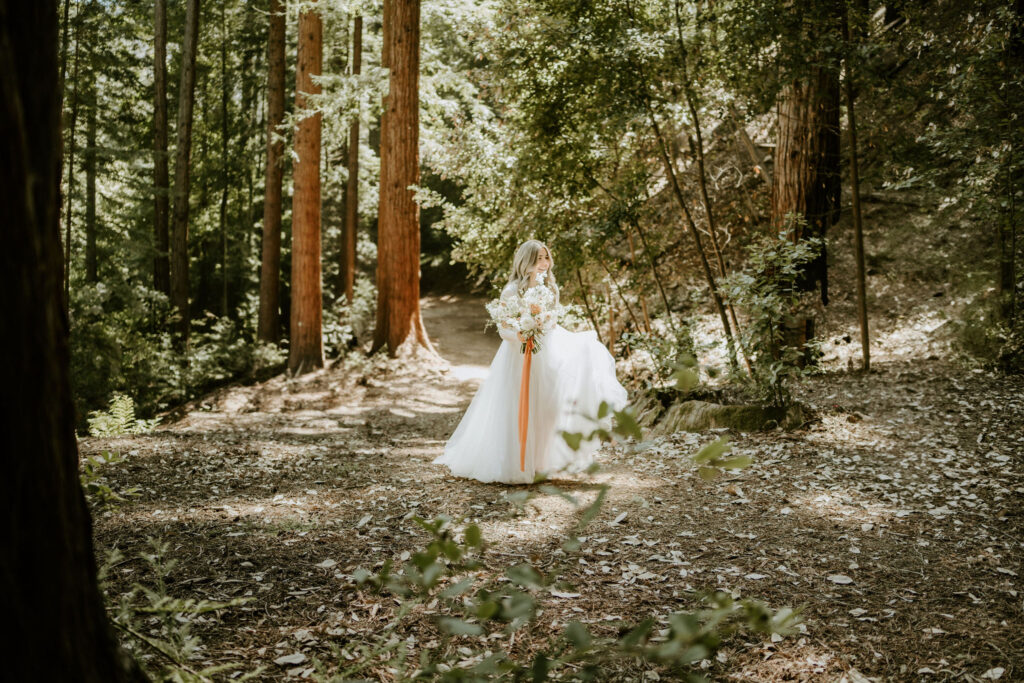 California redwood bride walking through the forest