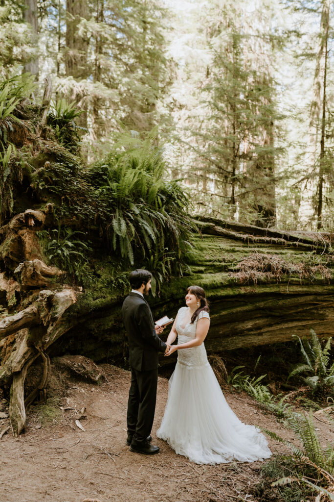 couple smiling during redwood forest elopement ceremony