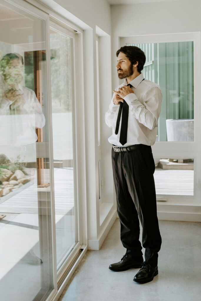 Groom getting ready for Redwood Forest Elopement