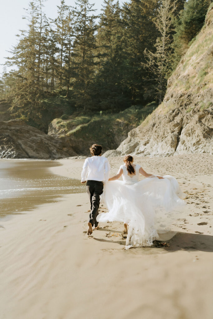 eloping couple enjoying the adventure of their day on the California coast at sunset