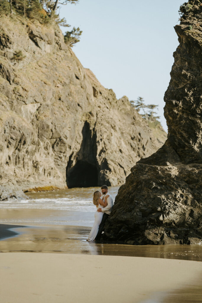 eloping couple taking in the views during their sunset elopement on the Oregon Coast