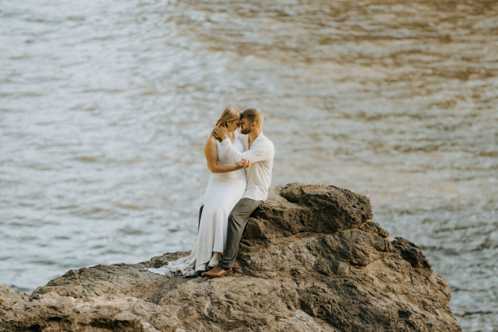 adventure wedding on the beach bride and groom kissing