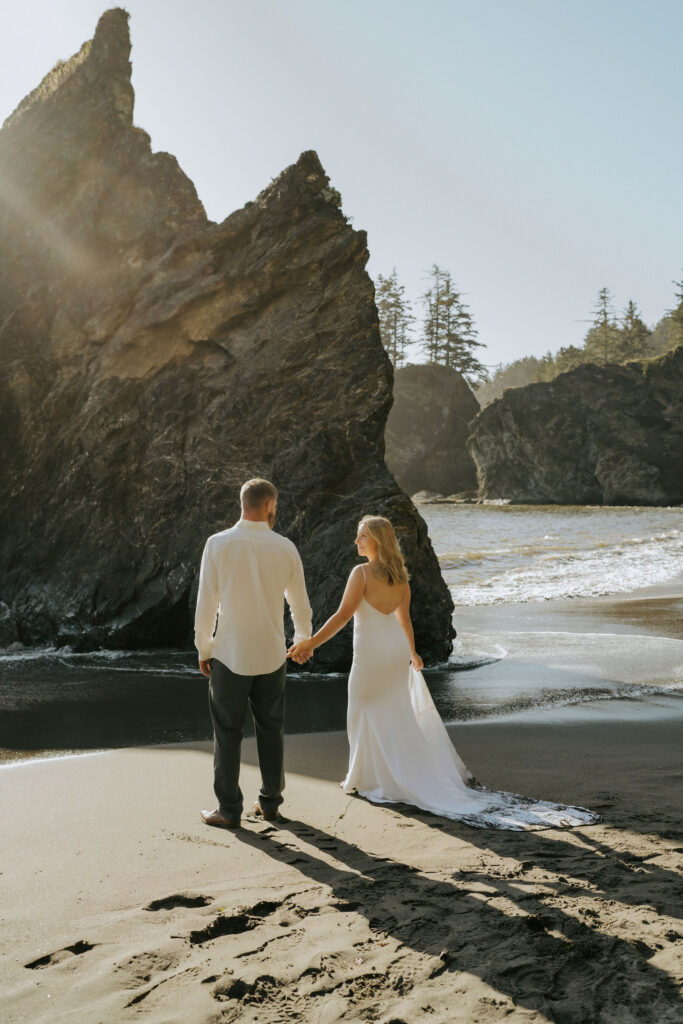 couple walking into the sunset on their elopement