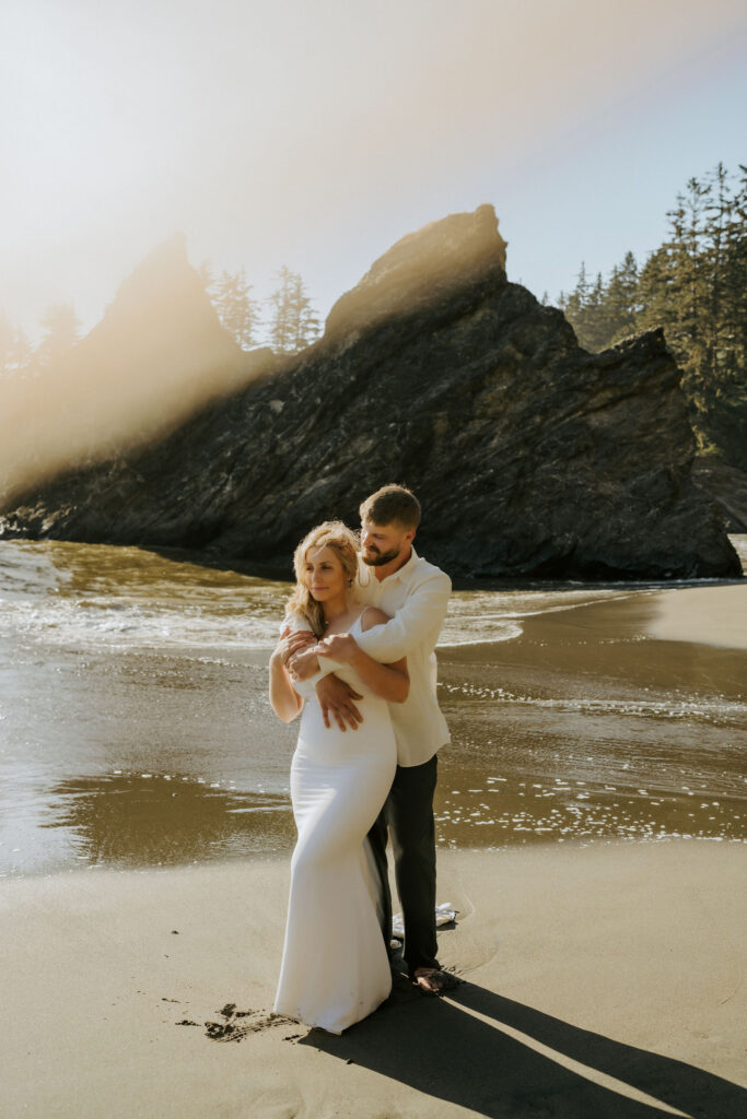 couple eloping at sunset on the beach