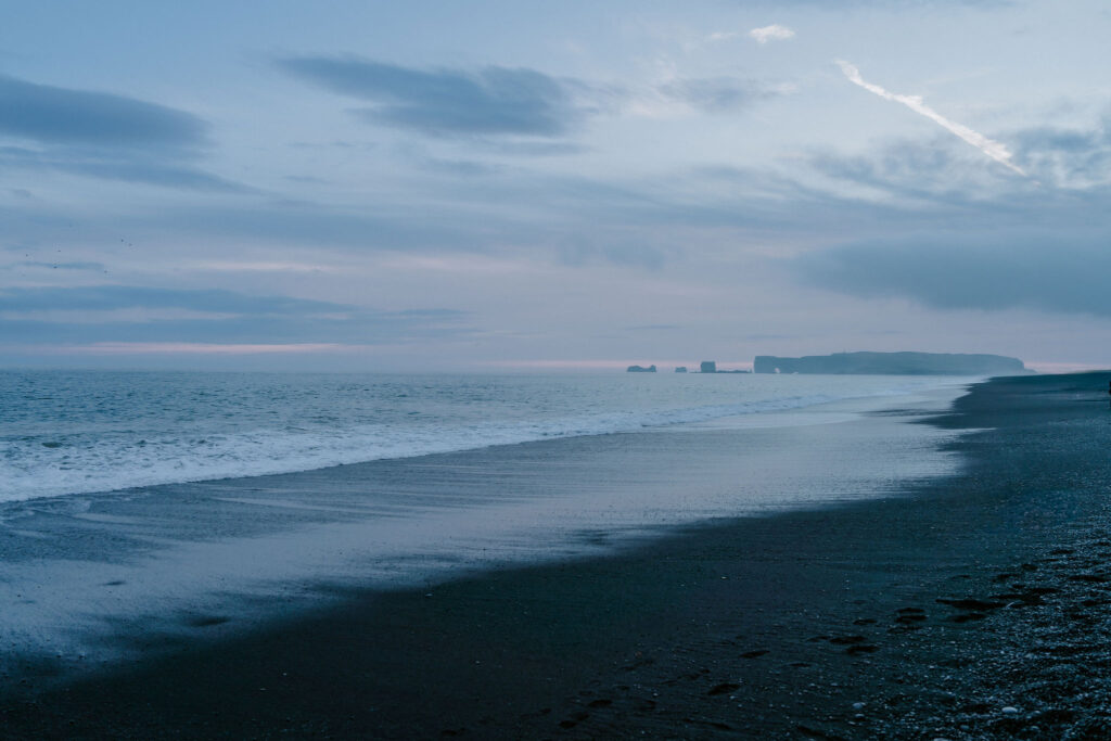 black sand beach at sunset in iceland