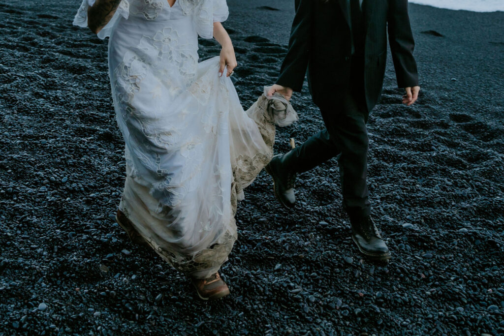 iceland elopement tips while walking on black sand beach