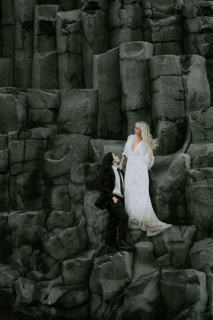 couple on the rocks of Reynisfjara while eloping in iceland