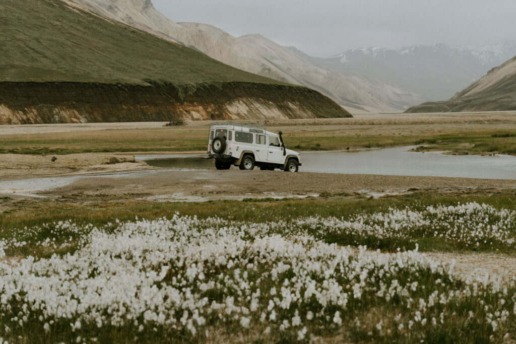 super jeep making a river crossing for adventure elopement in iceland