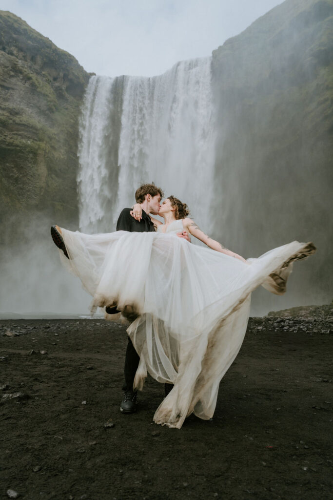 detail of brides dress at skogafoss iceland