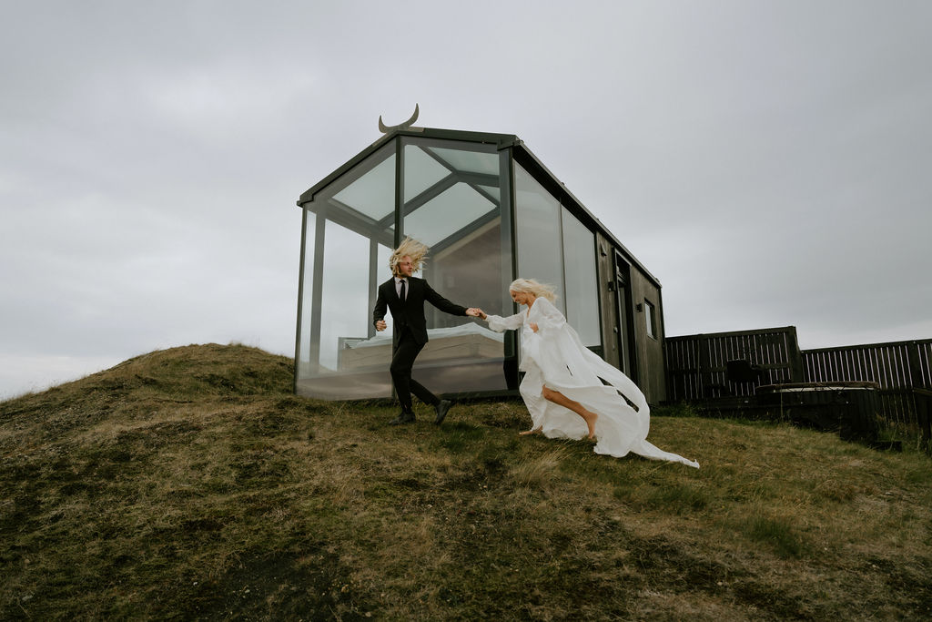 couple running on adventure elopement in iceland