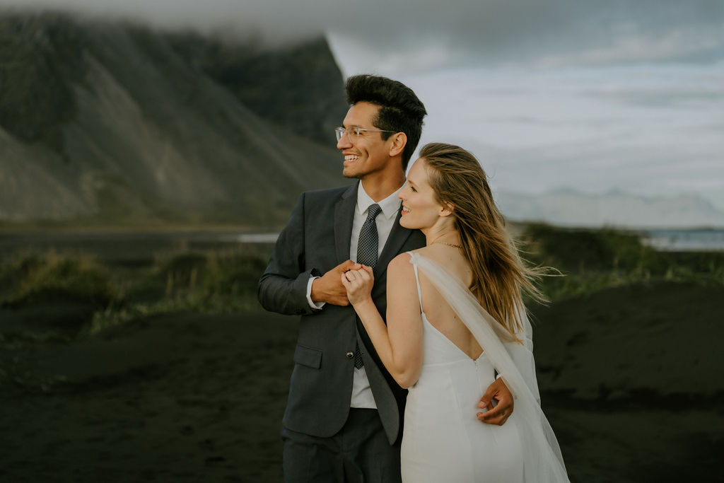 couple enjoying views while eloping in iceland at Stokksnes