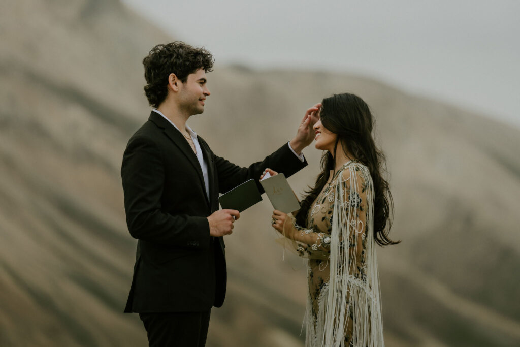 eloping couple exchanging vows in iceland highlands