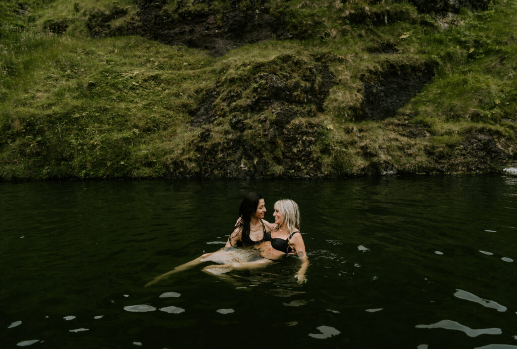 couple enjoying hot springs in iceland