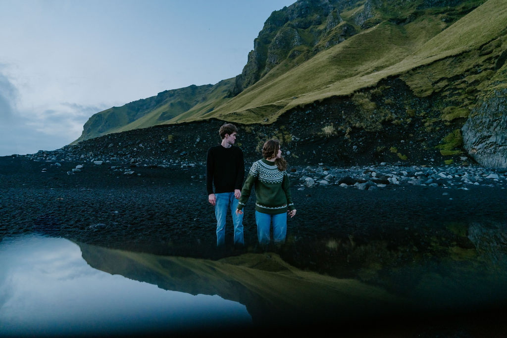 couple on black sand beach Reynisfjara