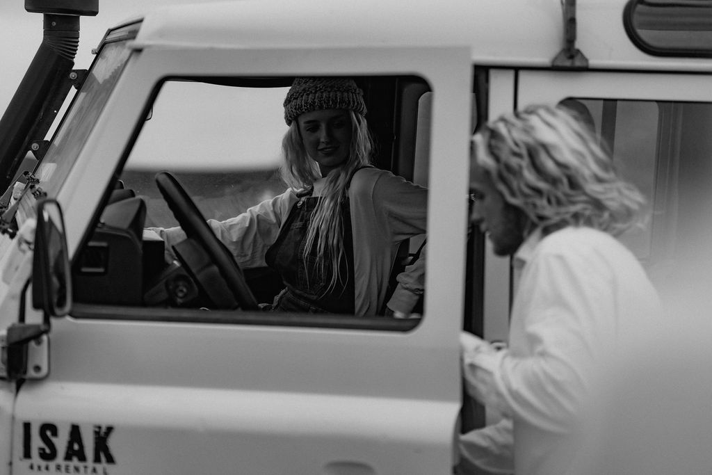 black and white couple in super jeep in iceland