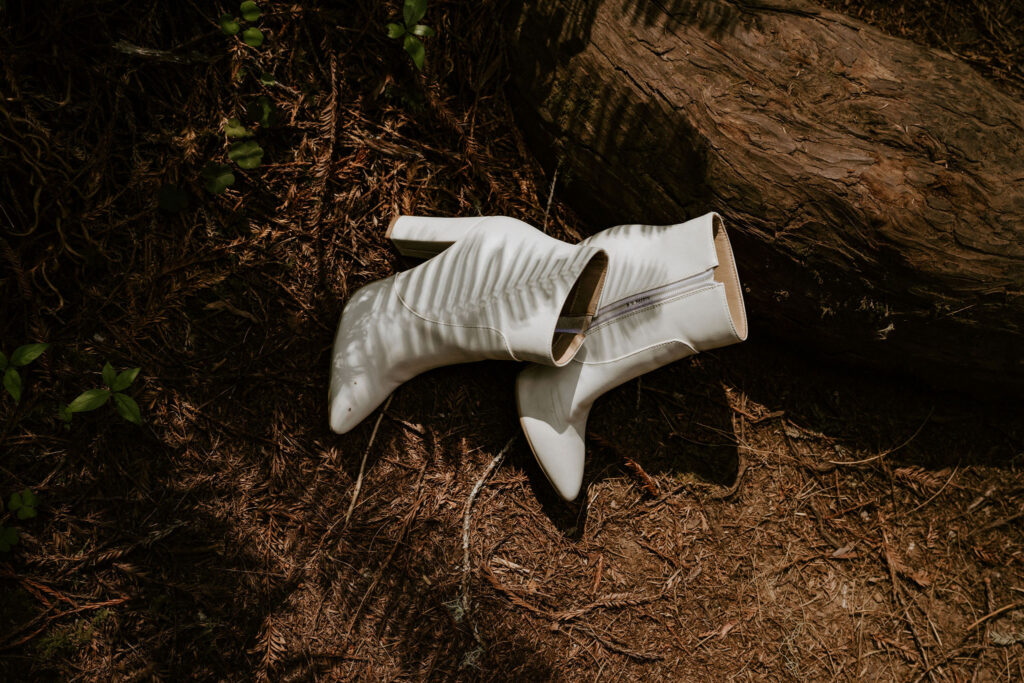 brides shoes on the ground during redwood elopement