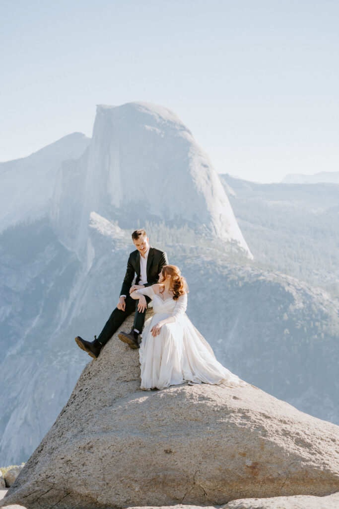 Bride and Groom sitting at Glacier Point