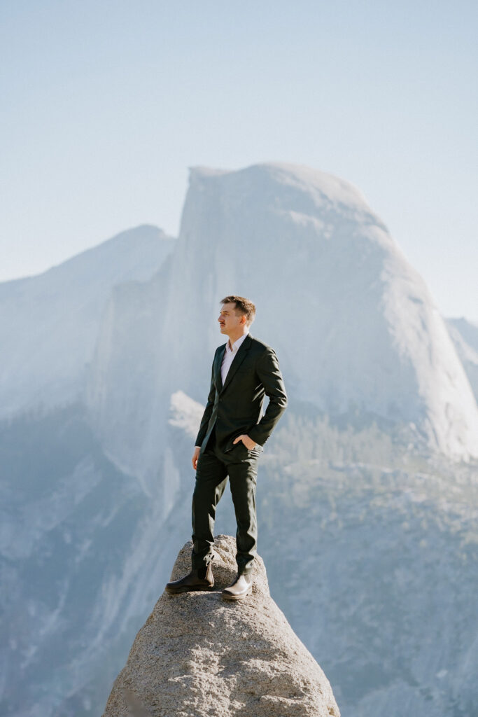 Groom standing at Glacier Point