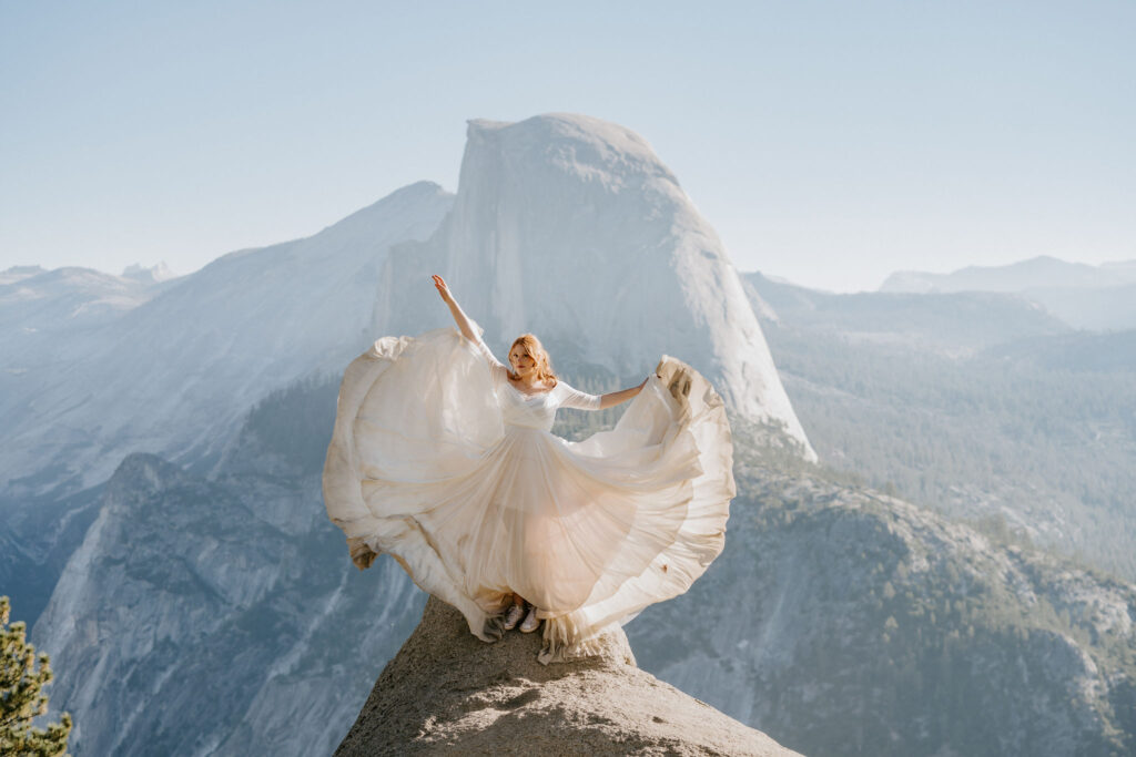 Bride throwing dress at Glacier Point