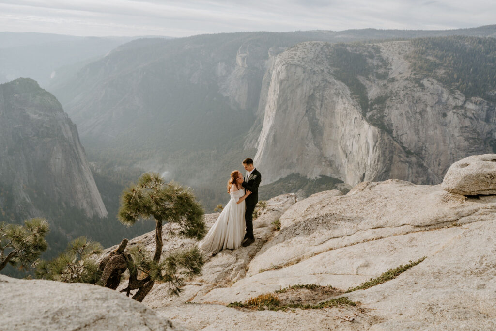 Taft point elopement couple taking in the Yosemite Valley views