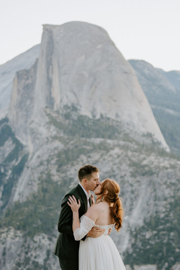 couple kissing after wedding ceremony