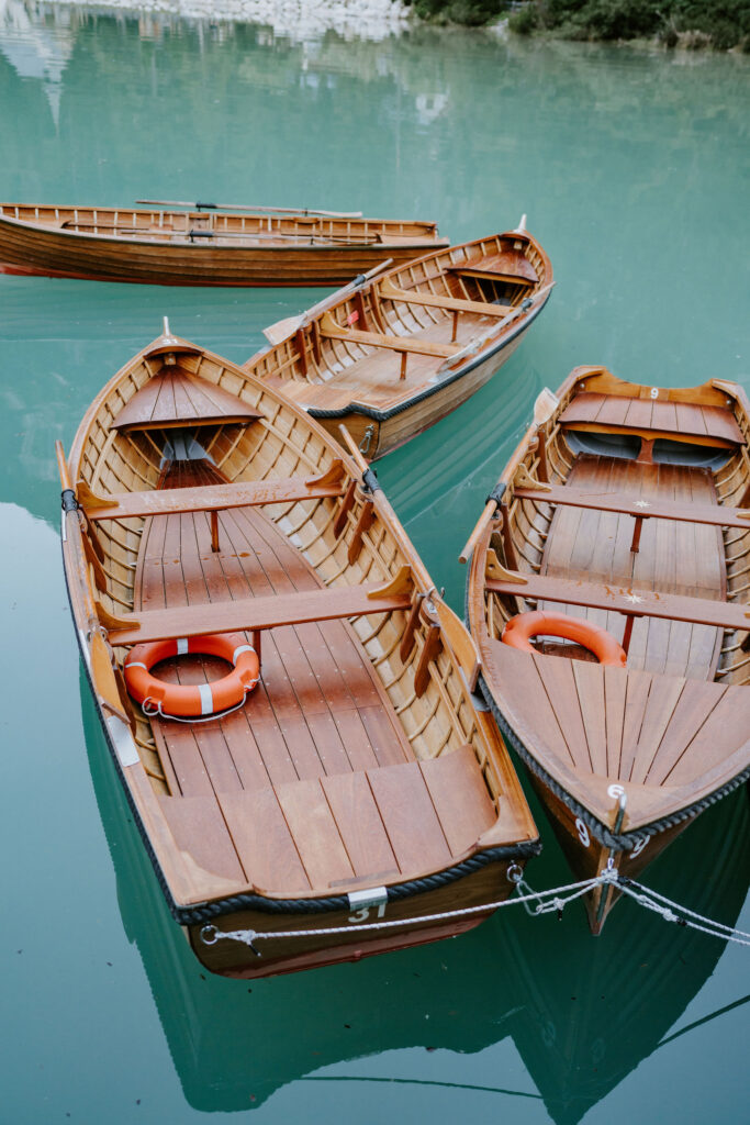 wooden rowboats in turquoise waters