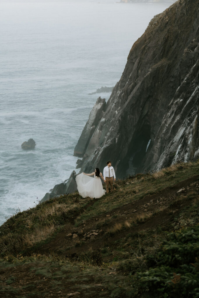 dramatic cannon beach elopement with ocean views and cliffs in the backdrop