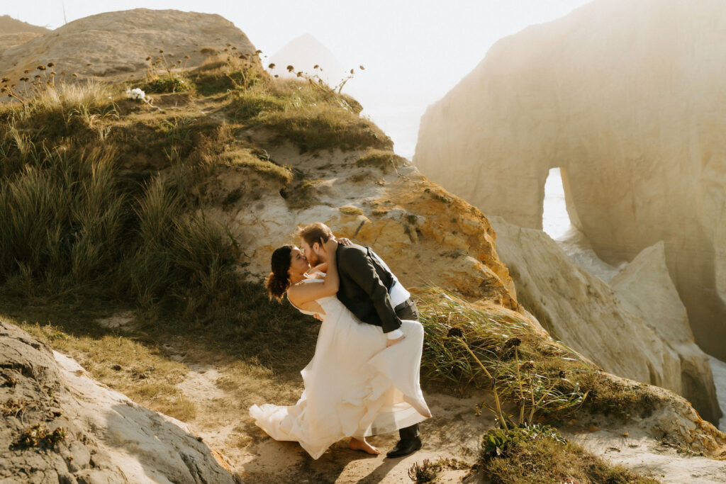 dramatic cannon beach elopement with ocean views and cliffs in the backdrop