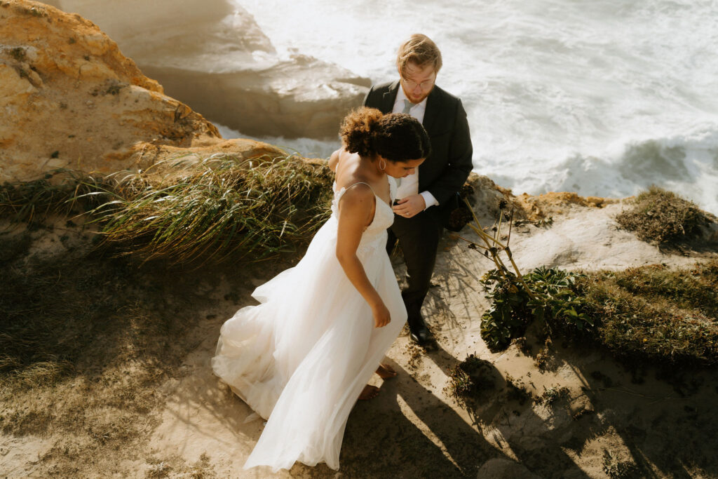 dramatic cannon beach elopement with ocean views and cliffs in the backdrop