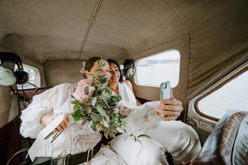 lgbtq elopement couple in a helicopter