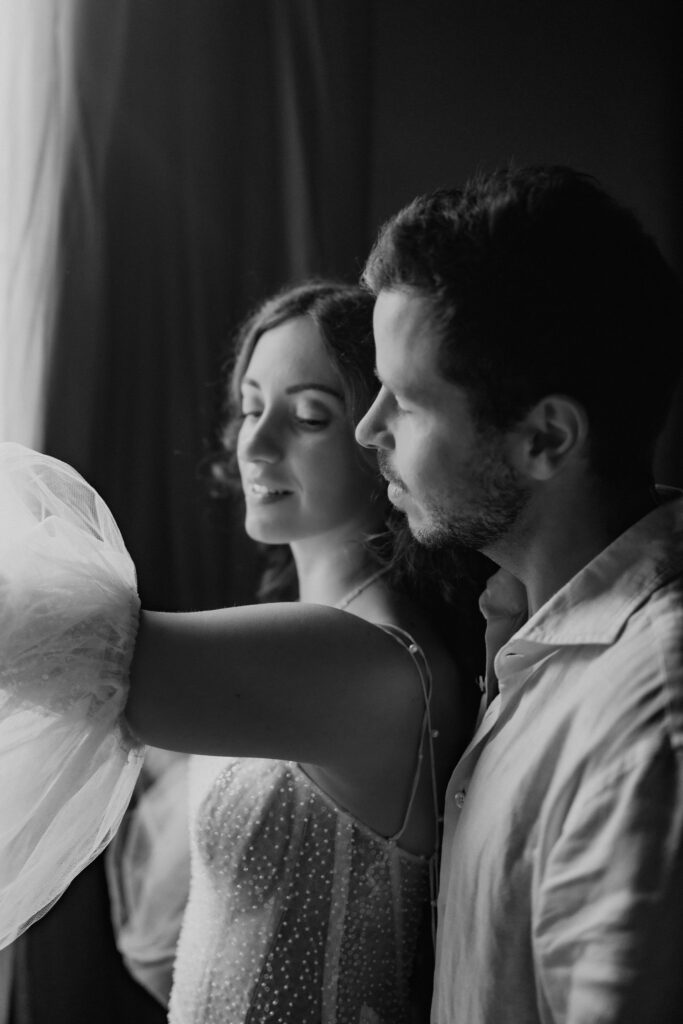 bride and groom at the hotel room in venice