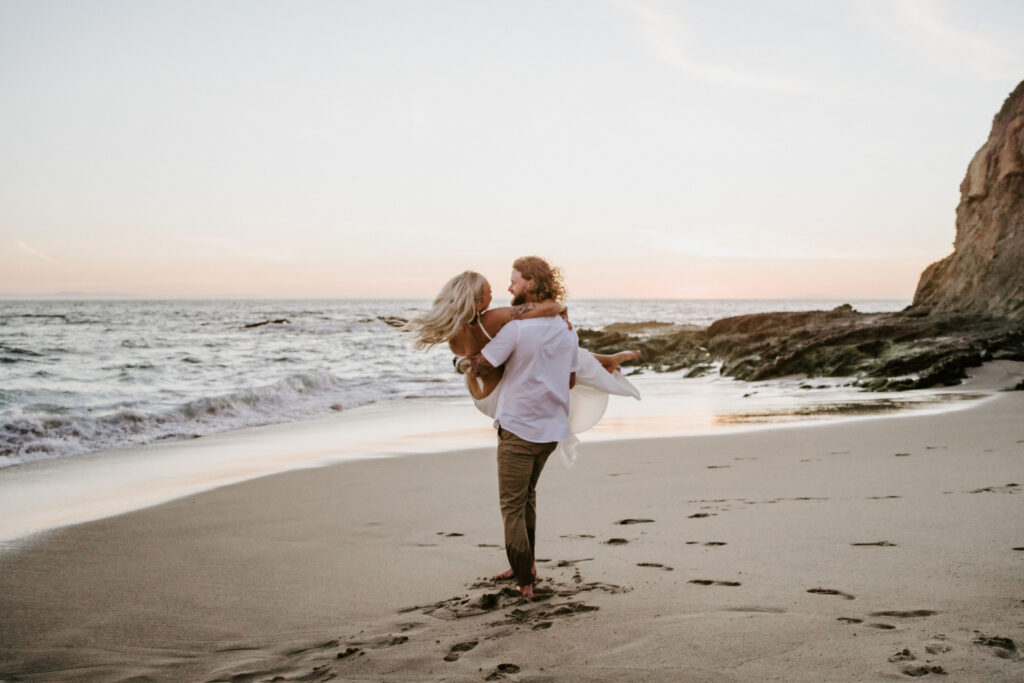 playful bride and groom at the beach during their Laguna Beach elopement in Southern California