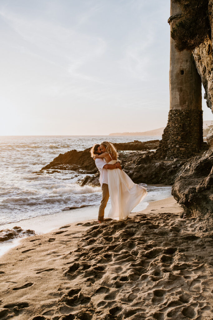 playful bride and groom at the beach during their Laguna Beach elopement in Southern California