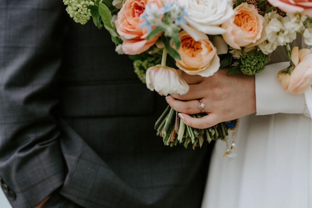close up of bride holding a colorful wedding bouquet