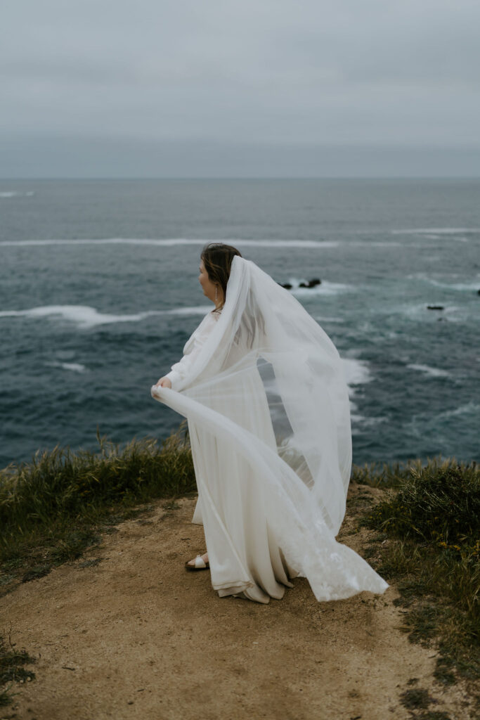 moody bridal portrait on a cliff