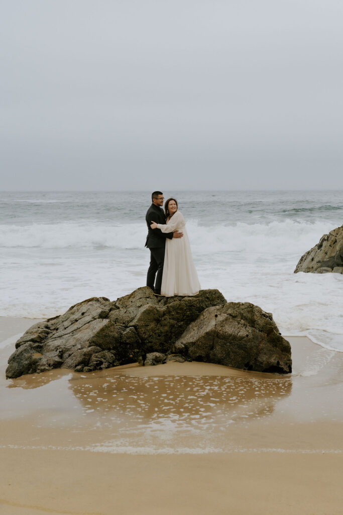 playful bride and groom at the beach during their Big Sur elopement day