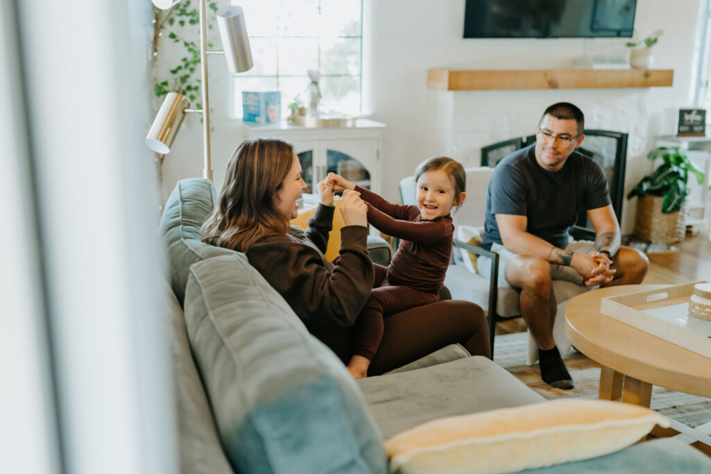 bride, groom and their little boy chilling at the airbnb together