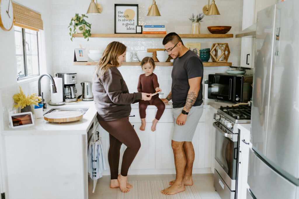 bride, groom and their little boy chilling at the airbnb together