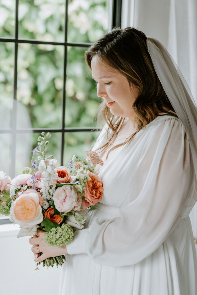 bridal portrait by the window at their airbnb