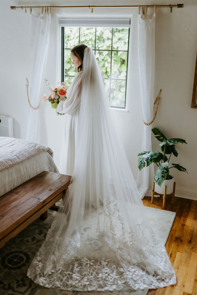 bridal portrait by the window at their airbnb